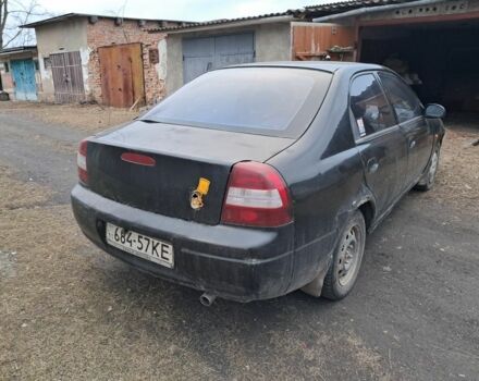 Чорний Кіа Сефія, об'ємом двигуна 1.5 л та пробігом 300 тис. км за 1308 $, фото 2 на Automoto.ua