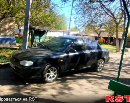 Черный Киа Сефия, объемом двигателя 1.5 л и пробегом 270 тыс. км за 900 $, фото 1 на Automoto.ua