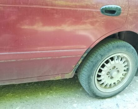 Красный Киа Сефия, объемом двигателя 1.5 л и пробегом 123 тыс. км за 850 $, фото 1 на Automoto.ua