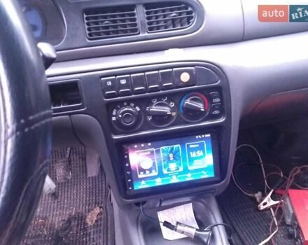 Красный Киа Сефия, объемом двигателя 1.5 л и пробегом 300 тыс. км за 1700 $, фото 10 на Automoto.ua