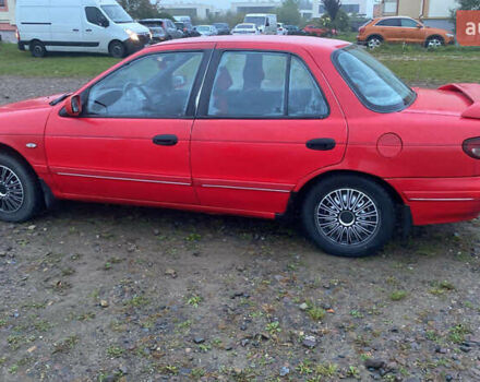 Красный Киа Сефия, объемом двигателя 1.6 л и пробегом 357 тыс. км за 1000 $, фото 1 на Automoto.ua