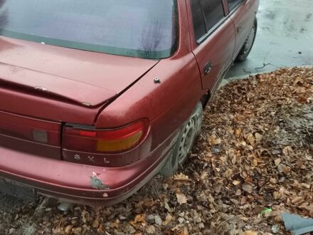 Красный Киа Сефия, объемом двигателя 1.6 л и пробегом 195 тыс. км за 474 $, фото 1 на Automoto.ua