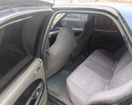 Синий Киа Сефия, объемом двигателя 1.8 л и пробегом 235 тыс. км за 1000 $, фото 5 на Automoto.ua