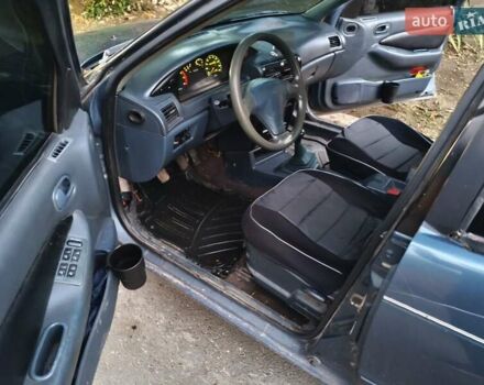 Синий Киа Сефия, объемом двигателя 1.6 л и пробегом 315 тыс. км за 1350 $, фото 2 на Automoto.ua