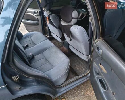 Синий Киа Сефия, объемом двигателя 1.6 л и пробегом 315 тыс. км за 1350 $, фото 3 на Automoto.ua