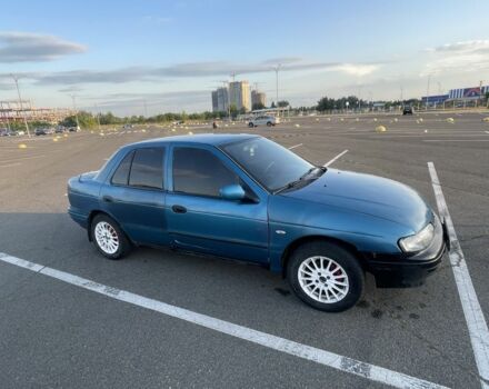 Синий Киа Сефия, объемом двигателя 1.6 л и пробегом 344 тыс. км за 600 $, фото 2 на Automoto.ua