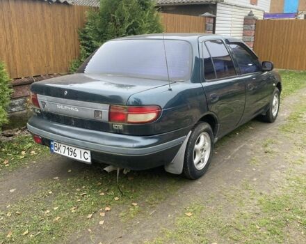 Зеленый Киа Сефия, объемом двигателя 1.6 л и пробегом 320 тыс. км за 870 $, фото 1 на Automoto.ua