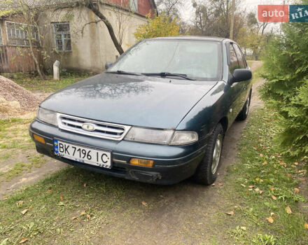 Зеленый Киа Сефия, объемом двигателя 1.6 л и пробегом 320 тыс. км за 870 $, фото 4 на Automoto.ua