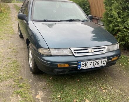 Зеленый Киа Сефия, объемом двигателя 1.6 л и пробегом 320 тыс. км за 870 $, фото 1 на Automoto.ua