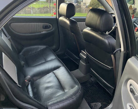 Черный Киа Шума, объемом двигателя 1.6 л и пробегом 308 тыс. км за 3100 $, фото 16 на Automoto.ua