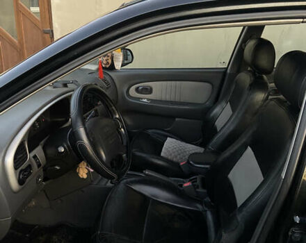 Черный Киа Шума, объемом двигателя 1.6 л и пробегом 308 тыс. км за 3100 $, фото 11 на Automoto.ua