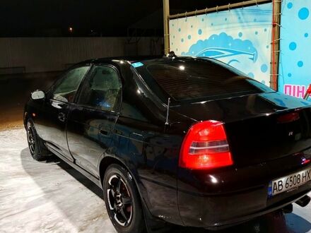 Чорний Кіа Шума, об'ємом двигуна 1.5 л та пробігом 235 тис. км за 2000 $, фото 1 на Automoto.ua