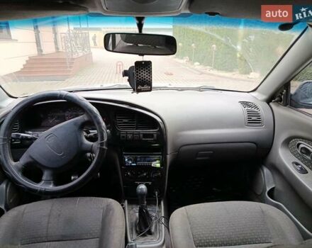 Серый Киа Шума, объемом двигателя 1.6 л и пробегом 300 тыс. км за 2499 $, фото 5 на Automoto.ua