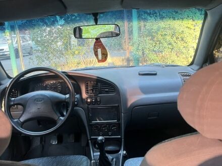 Серый Киа Шума, объемом двигателя 1.5 л и пробегом 136 тыс. км за 2054 $, фото 1 на Automoto.ua