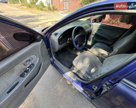 Синій Кіа Шума, об'ємом двигуна 1.5 л та пробігом 300 тис. км за 1600 $, фото 7 на Automoto.ua