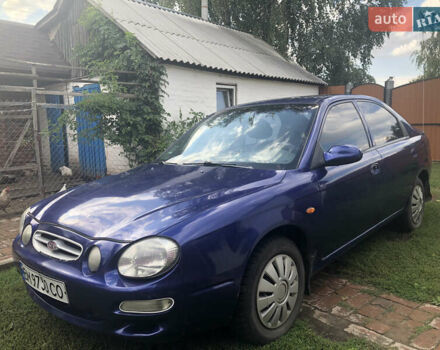 Синий Киа Шума, объемом двигателя 1.5 л и пробегом 240 тыс. км за 1500 $, фото 2 на Automoto.ua