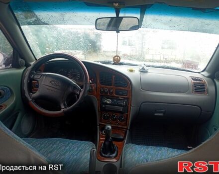 Синий Киа Шума, объемом двигателя 1.5 л и пробегом 305 тыс. км за 2100 $, фото 2 на Automoto.ua
