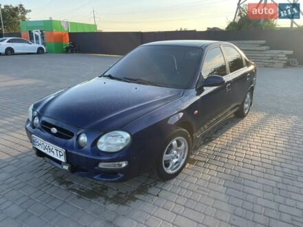 Синий Киа Шума, объемом двигателя 1.8 л и пробегом 322 тыс. км за 1700 $, фото 1 на Automoto.ua