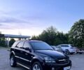 Черный Киа Соренто, объемом двигателя 2.5 л и пробегом 400 тыс. км за 7000 $, фото 1 на Automoto.ua