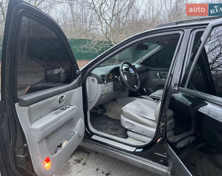 Черный Киа Соренто, объемом двигателя 2.5 л и пробегом 340 тыс. км за 7500 $, фото 7 на Automoto.ua