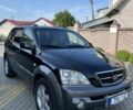 Черный Киа Соренто, объемом двигателя 2.5 л и пробегом 320 тыс. км за 4900 $, фото 1 на Automoto.ua