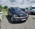 Черный Киа Соренто, объемом двигателя 2.5 л и пробегом 247 тыс. км за 5800 $, фото 1 на Automoto.ua
