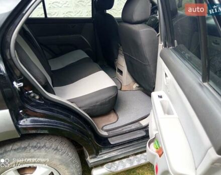 Черный Киа Соренто, объемом двигателя 2.5 л и пробегом 310 тыс. км за 8600 $, фото 6 на Automoto.ua