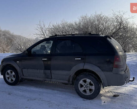 Черный Киа Соренто, объемом двигателя 2.5 л и пробегом 290 тыс. км за 6700 $, фото 1 на Automoto.ua