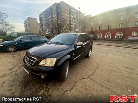Черный Киа Соренто, объемом двигателя 2.5 л и пробегом 325 тыс. км за 4300 $, фото 1 на Automoto.ua