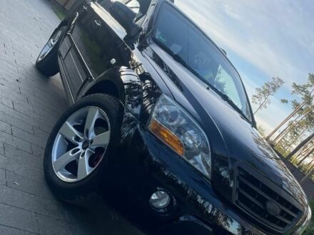 Черный Киа Соренто, объемом двигателя 2.5 л и пробегом 255 тыс. км за 8600 $, фото 1 на Automoto.ua