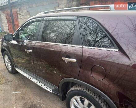 Красный Киа Соренто, объемом двигателя 2.4 л и пробегом 179 тыс. км за 12600 $, фото 1 на Automoto.ua