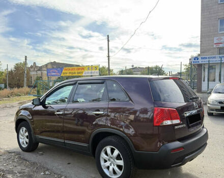 Красный Киа Соренто, объемом двигателя 2.4 л и пробегом 280 тыс. км за 10200 $, фото 2 на Automoto.ua