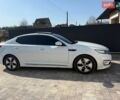 Белый Киа K5, объемом двигателя 2 л и пробегом 234 тыс. км за 10000 $, фото 1 на Automoto.ua
