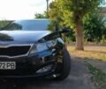Черный Киа K5, объемом двигателя 2 л и пробегом 195 тыс. км за 7300 $, фото 1 на Automoto.ua