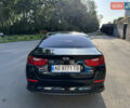 Черный Киа K5, объемом двигателя 2 л и пробегом 202 тыс. км за 9900 $, фото 4 на Automoto.ua