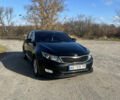 Черный Киа K5, объемом двигателя 2 л и пробегом 196 тыс. км за 9900 $, фото 1 на Automoto.ua