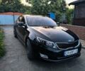 Черный Киа K5, объемом двигателя 2 л и пробегом 220 тыс. км за 12000 $, фото 1 на Automoto.ua