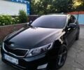 Черный Киа K5, объемом двигателя 2 л и пробегом 220 тыс. км за 12000 $, фото 1 на Automoto.ua