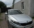 Серый Киа K5, объемом двигателя 2 л и пробегом 315 тыс. км за 6500 $, фото 1 на Automoto.ua