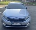 Серый Киа K5, объемом двигателя 2 л и пробегом 230 тыс. км за 7000 $, фото 1 на Automoto.ua