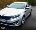Серый Киа K5, объемом двигателя 2 л и пробегом 170 тыс. км за 10000 $, фото 1 на Automoto.ua