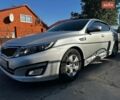 Серый Киа K5, объемом двигателя 2 л и пробегом 230 тыс. км за 7000 $, фото 1 на Automoto.ua