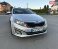Серый Киа K5, объемом двигателя 2 л и пробегом 230 тыс. км за 7000 $, фото 1 на Automoto.ua