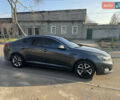Серый Киа K5, объемом двигателя 2 л и пробегом 200 тыс. км за 11000 $, фото 1 на Automoto.ua