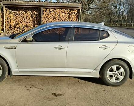 Серый Киа K5, объемом двигателя 2 л и пробегом 270 тыс. км за 8900 $, фото 3 на Automoto.ua