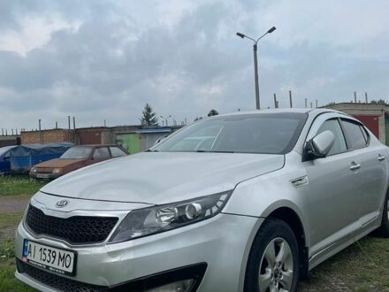 Серый Киа K5, объемом двигателя 2 л и пробегом 200 тыс. км за 8500 $, фото 1 на Automoto.ua