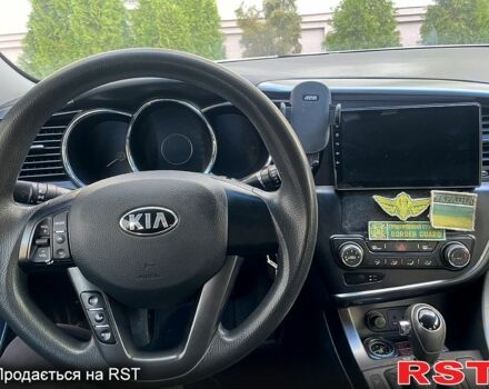 Серый Киа K5, объемом двигателя 2 л и пробегом 179 тыс. км за 7200 $, фото 1 на Automoto.ua