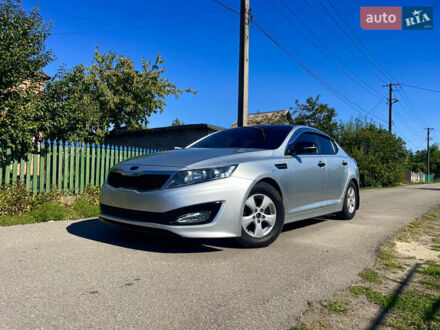 Серый Киа K5, объемом двигателя 2 л и пробегом 312 тыс. км за 7999 $, фото 1 на Automoto.ua