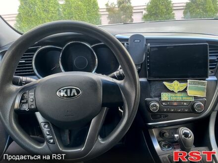 Серый Киа K5, объемом двигателя 2 л и пробегом 179 тыс. км за 7200 $, фото 1 на Automoto.ua