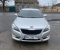 Серый Киа K7, объемом двигателя 3 л и пробегом 130 тыс. км за 7900 $, фото 1 на Automoto.ua